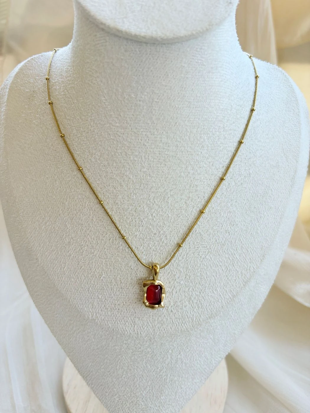 Golden whisper red stone chain