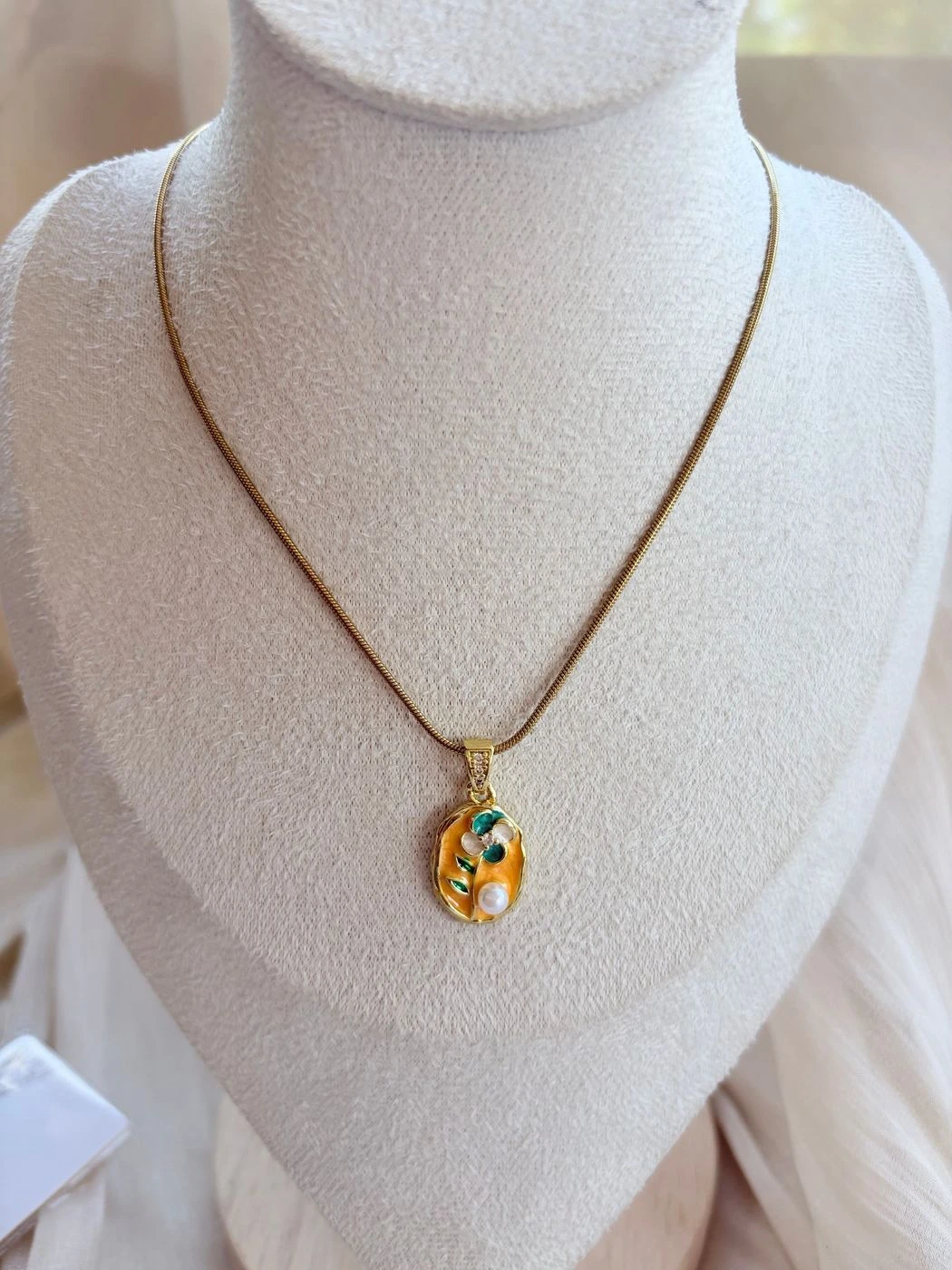 Orange floral enamel pendant