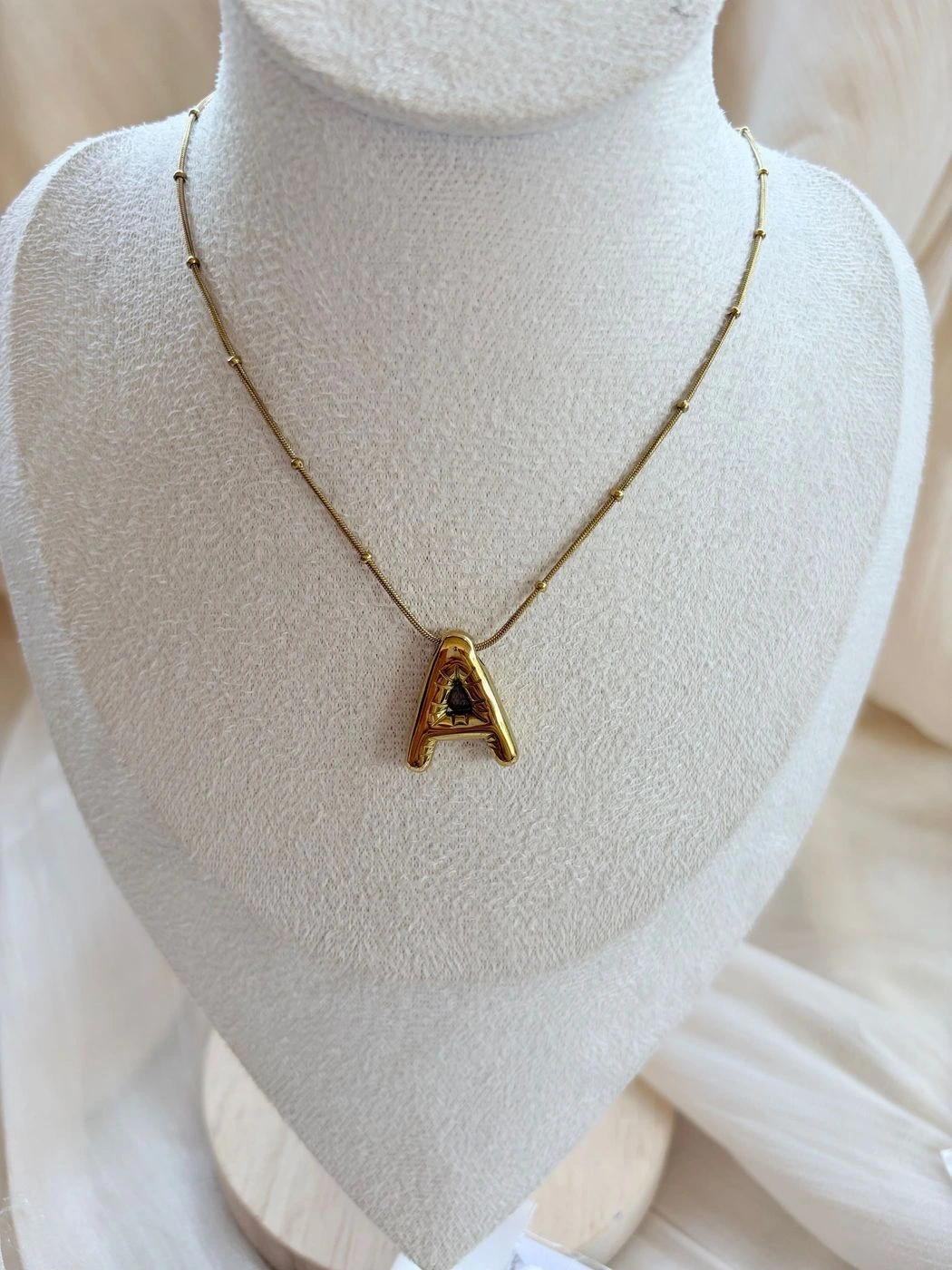 A Bubble letter pendant