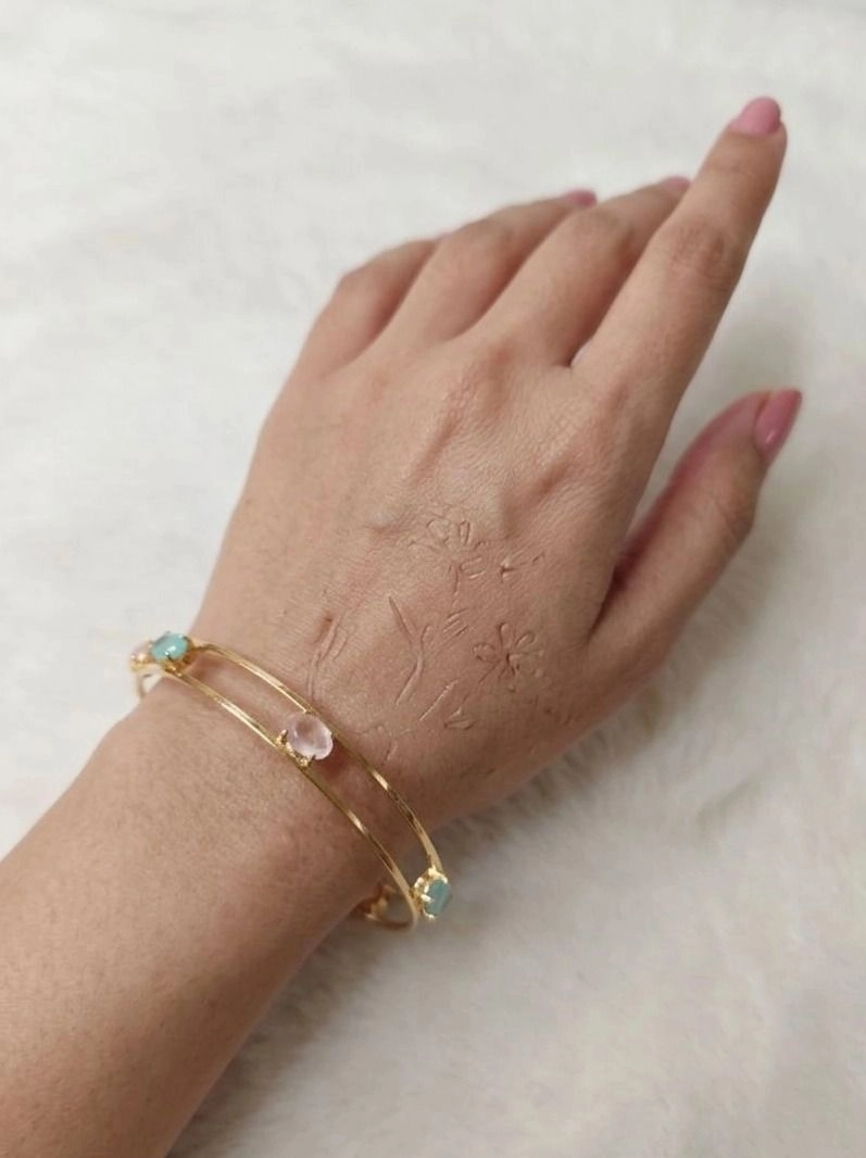 Modern gold-tone bangles. 1