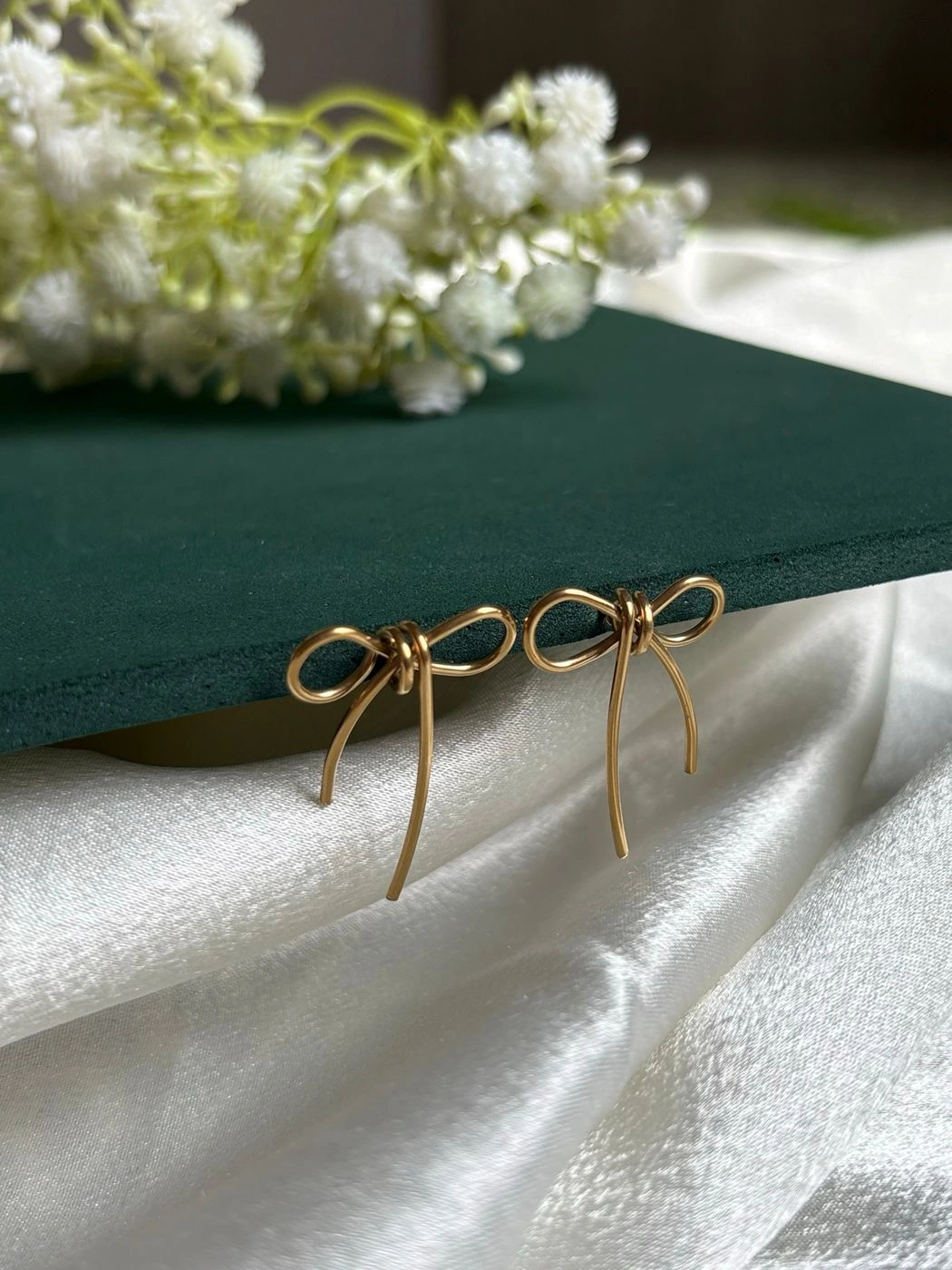 Knotted bow statement earrings 1