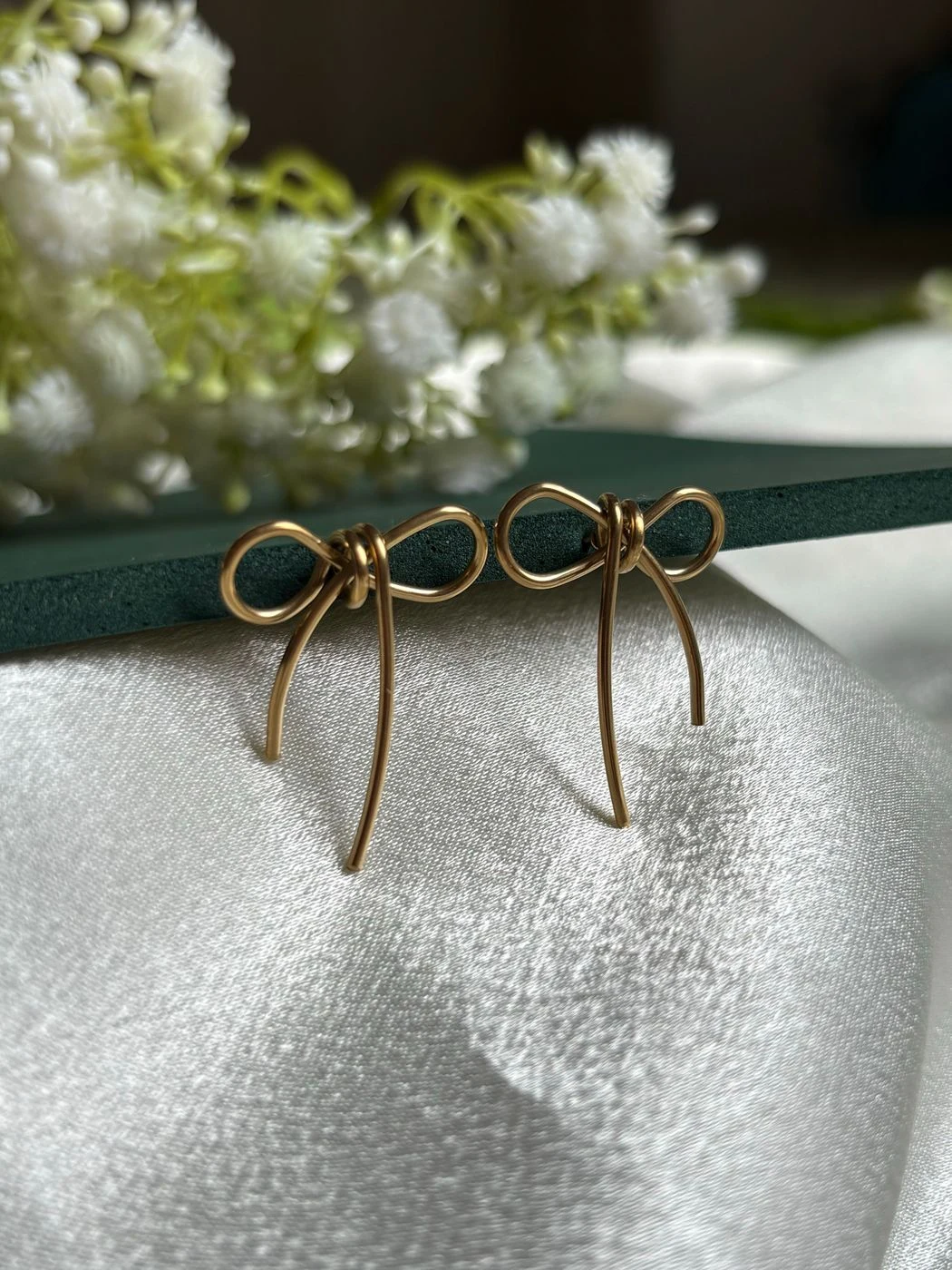 Knotted bow statement earrings 2