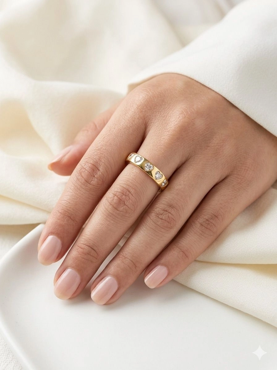 Heart atone studded golden ring