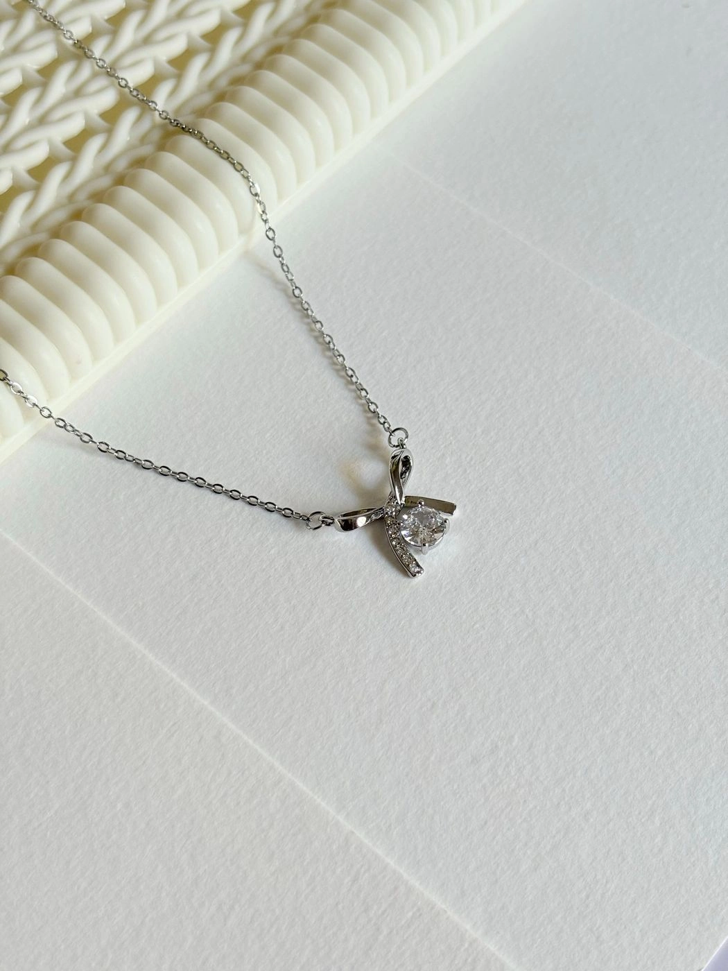 Infinity bow stone chain