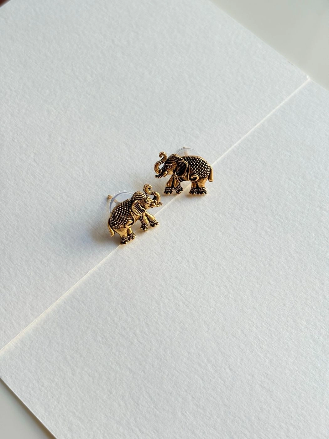 Golden elephant stud earrings