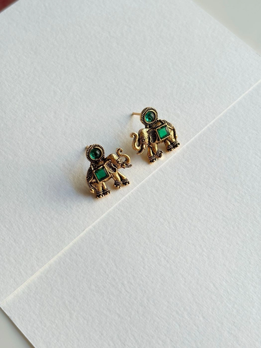 Emerald elephant stud earrings
