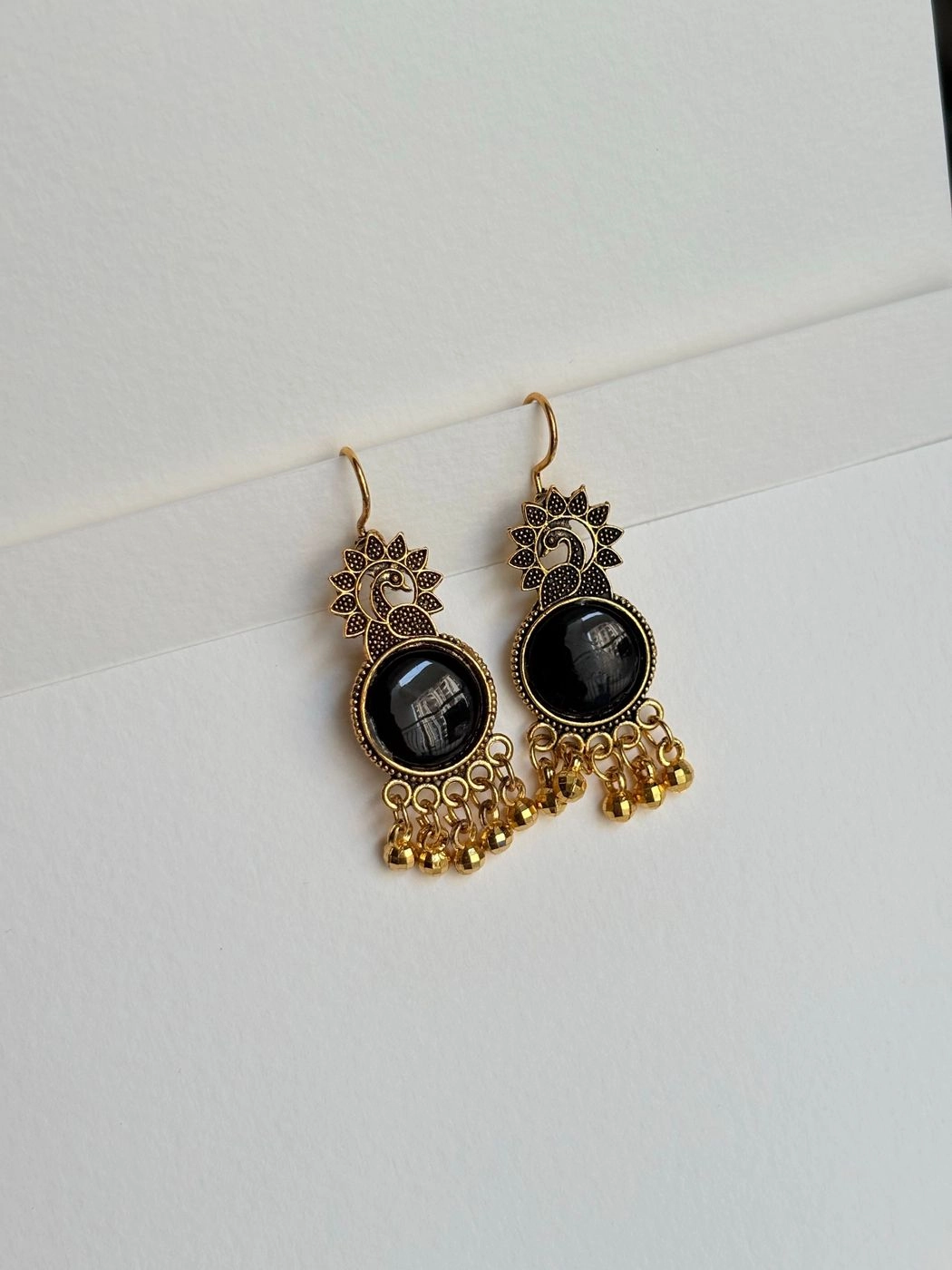Golden peacock earrings 1