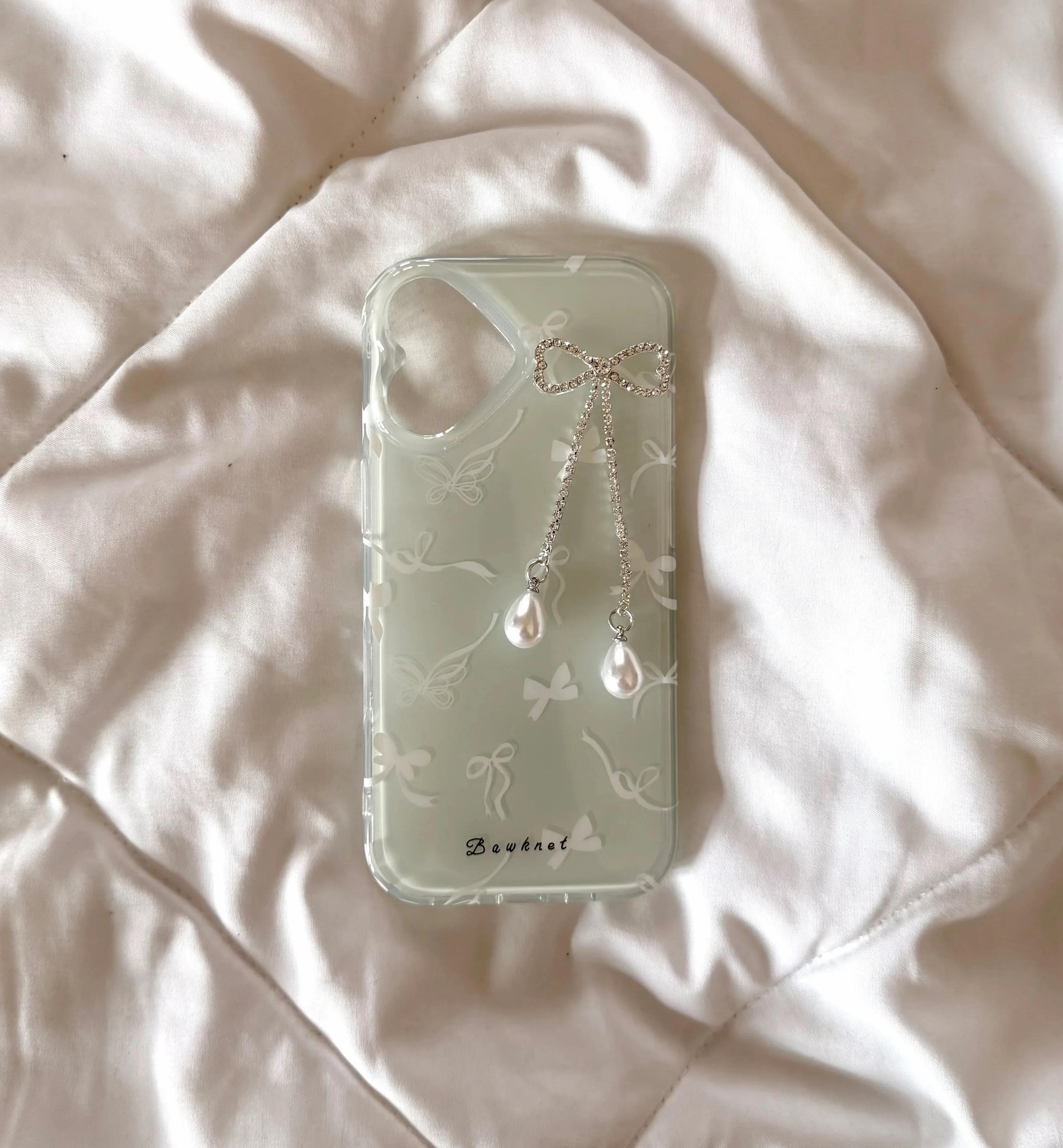 Mint green case with bow charm