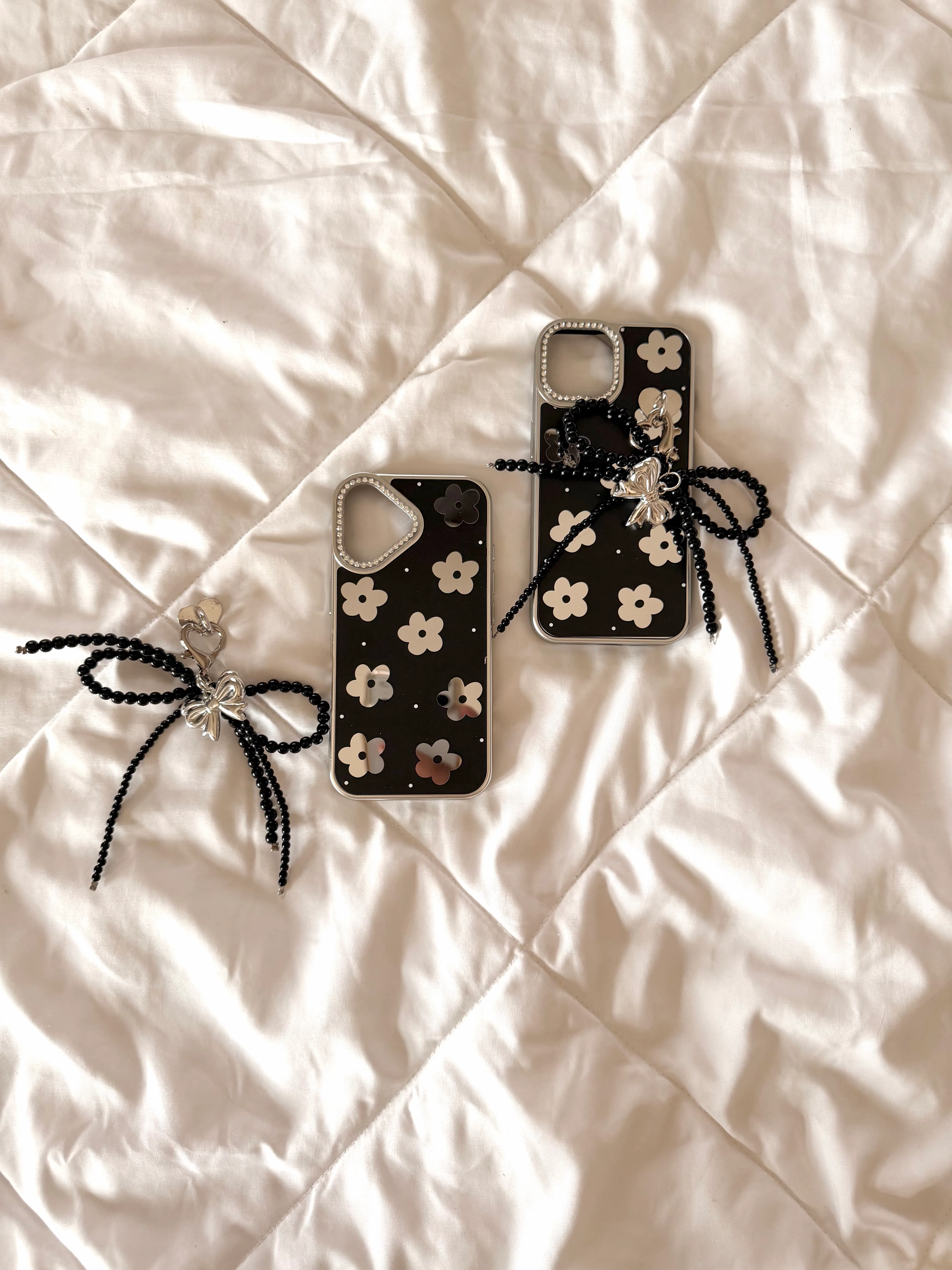 Black floral case with pearl charm