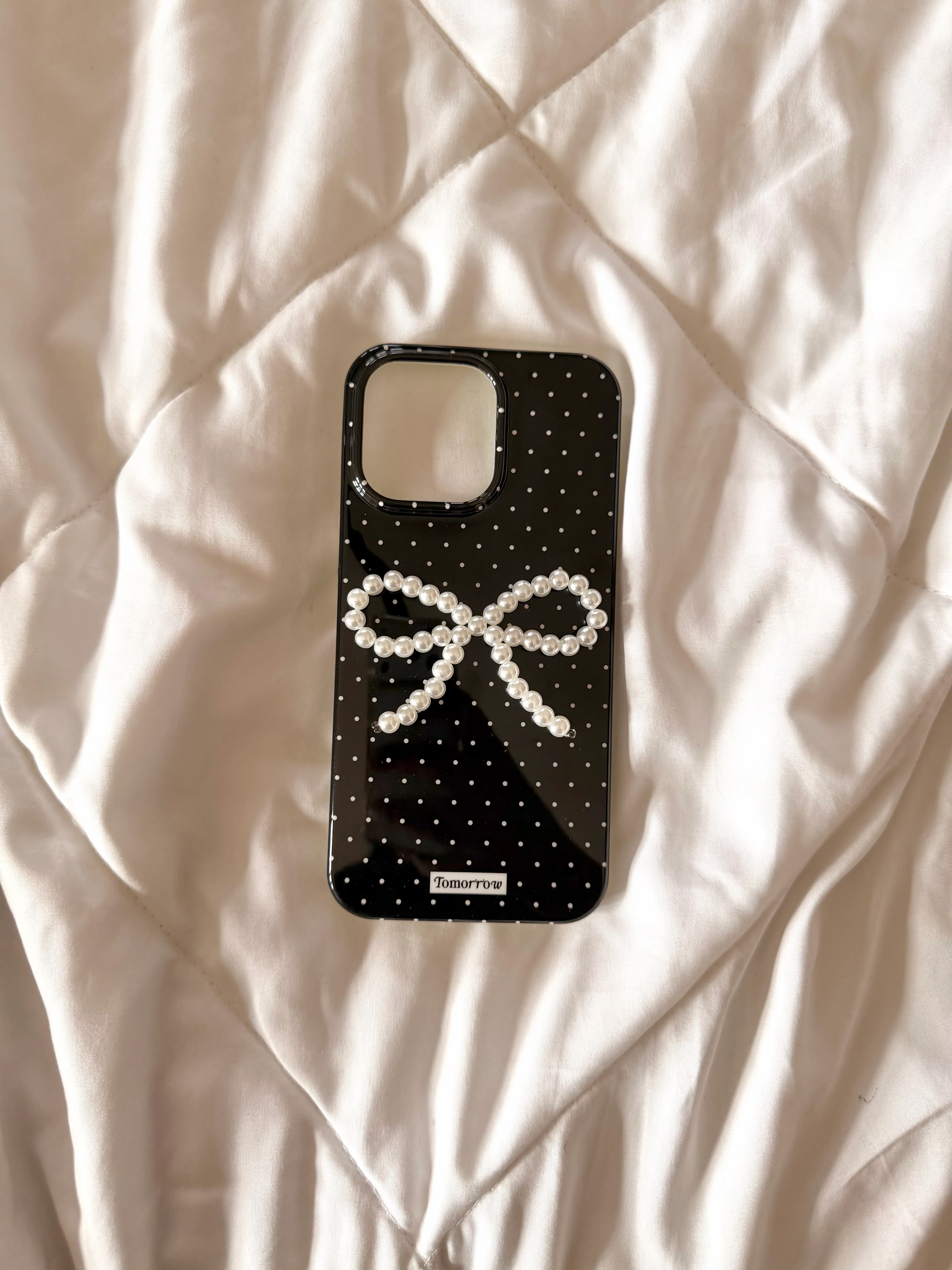 Polka dot case with pearl bow