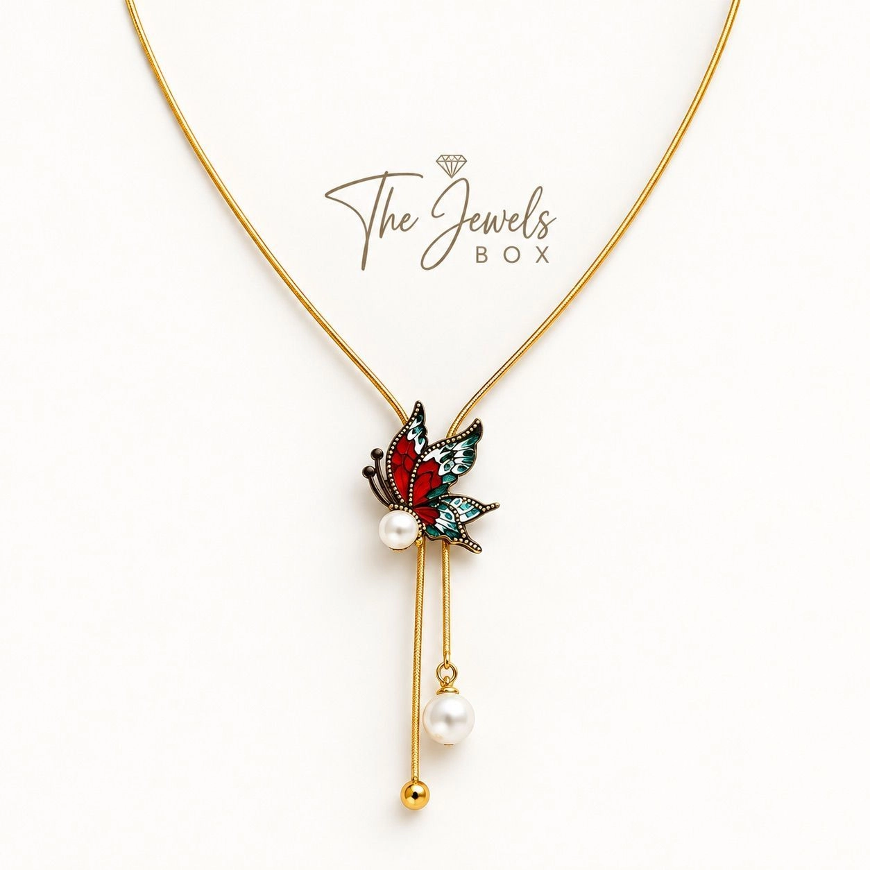 BUTTERFLY PENDANT NECKLACE ADORNED WITH FAUX PEARLS AND A TASSEL DROP 2