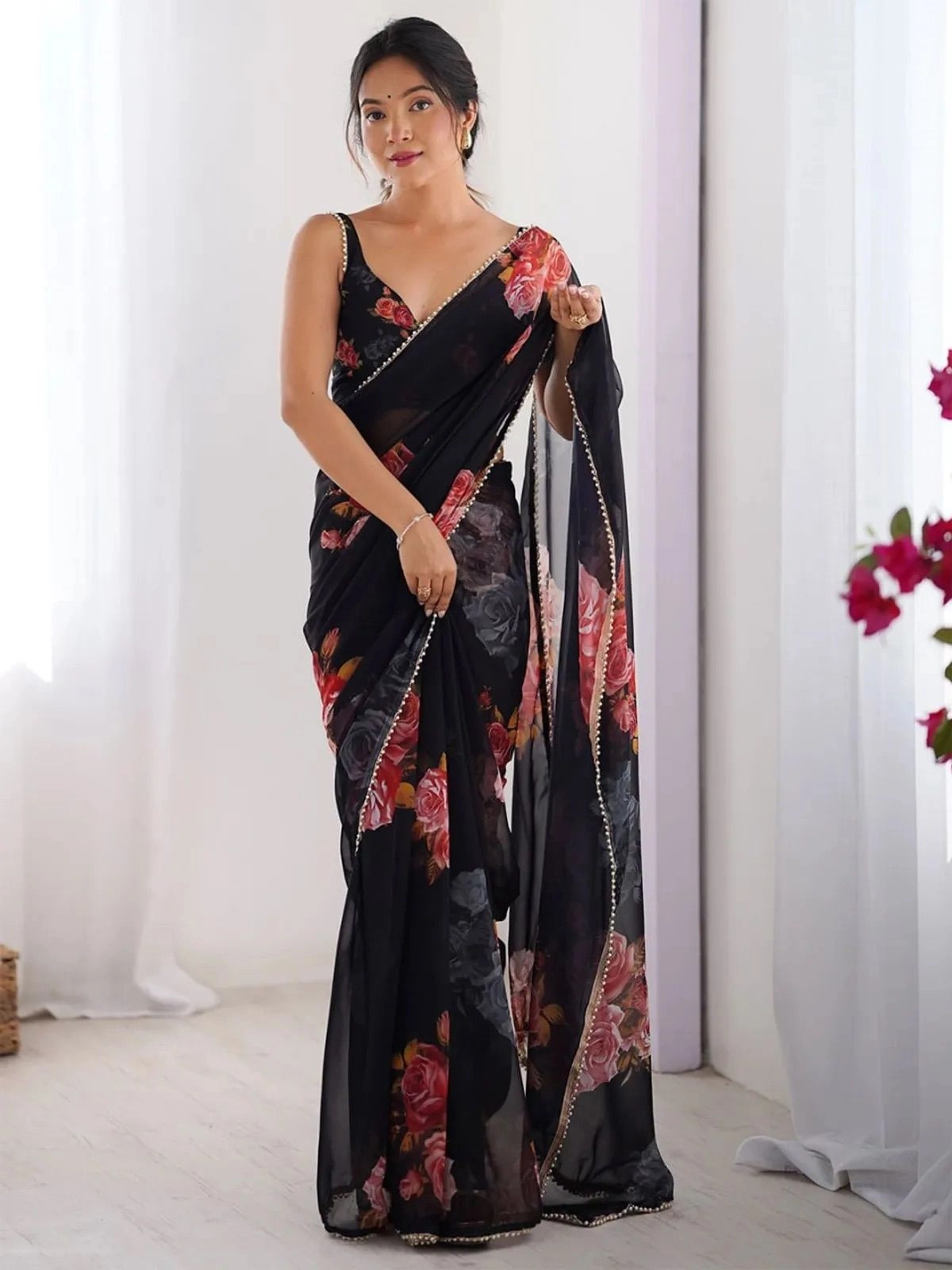 Black color georgette saree with printed work and moti border 1