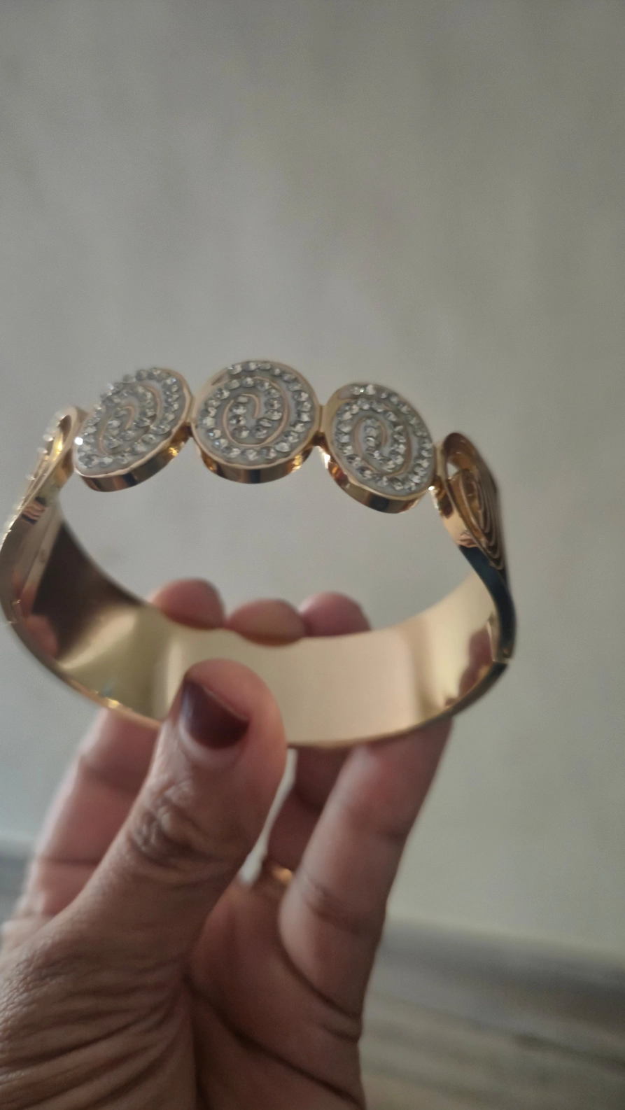 Crystal-Encrusted Spiral Medallion Bangle 1