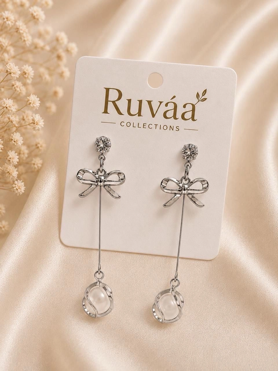 Bow pearl drop earrings