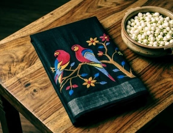 Premium, breathable charcoal-black linen with a rich natural texture saree
