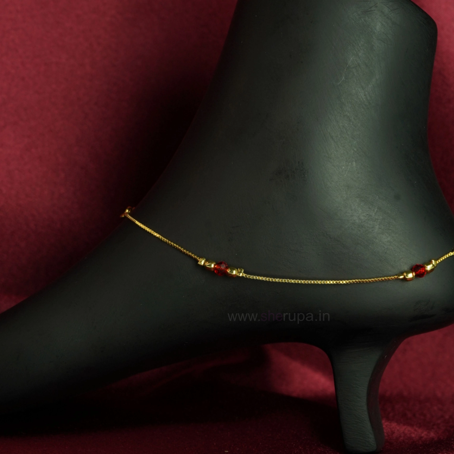 Gold Tone Anklet Accented with Small Metallic Beads and a Vibrant Red Crystal Bead | 1 Pair (2 Anklets)