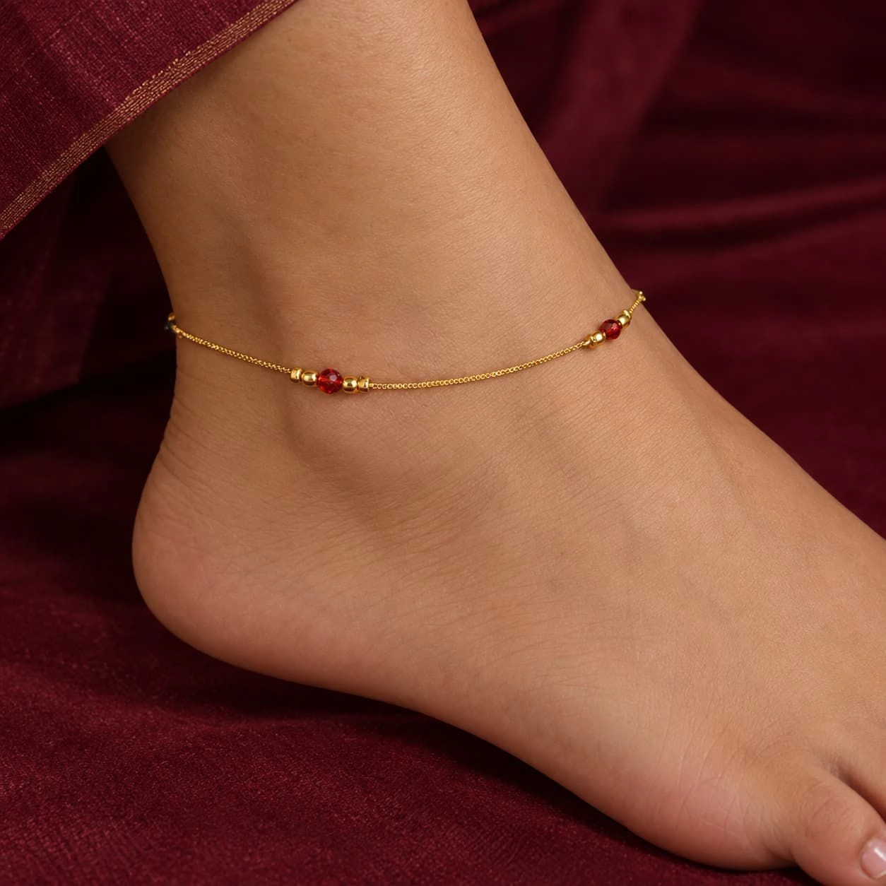 Gold Tone Anklet Accented with Small Metallic Beads and a Vibrant Red Crystal Bead | 1 Pair (2 Anklets) 1