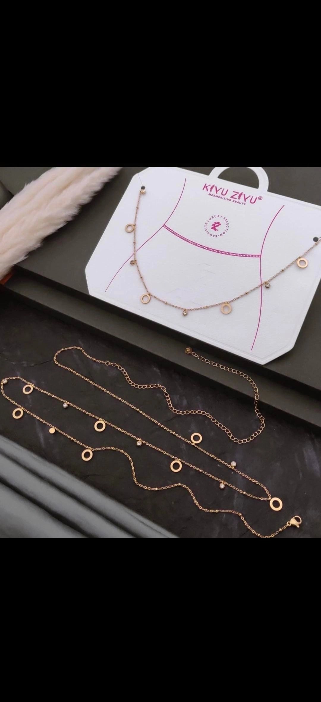 Open circle and stone hip chain