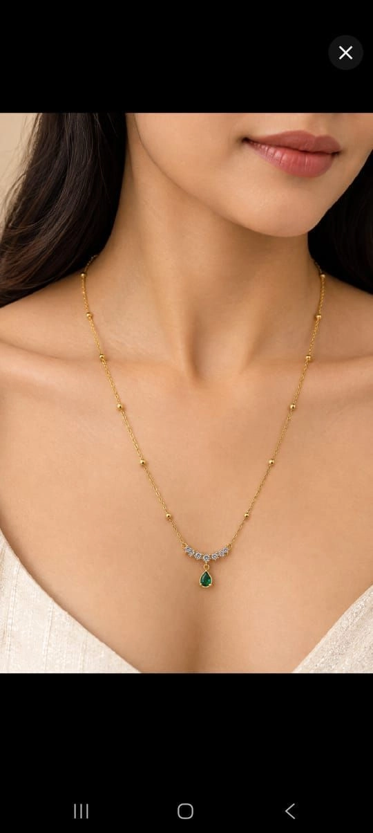 White stones and hanging green stone necklace